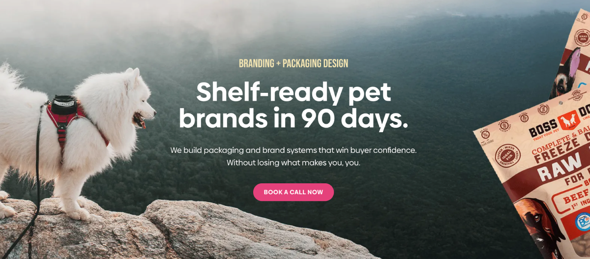 White dog on a cliff with pet food packaging.